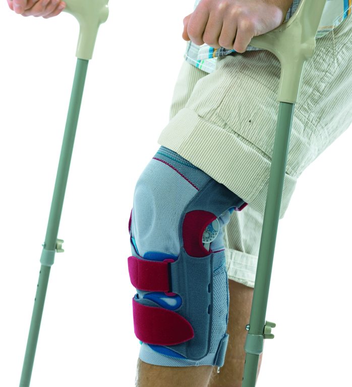 Man on crutches and knee in a brace