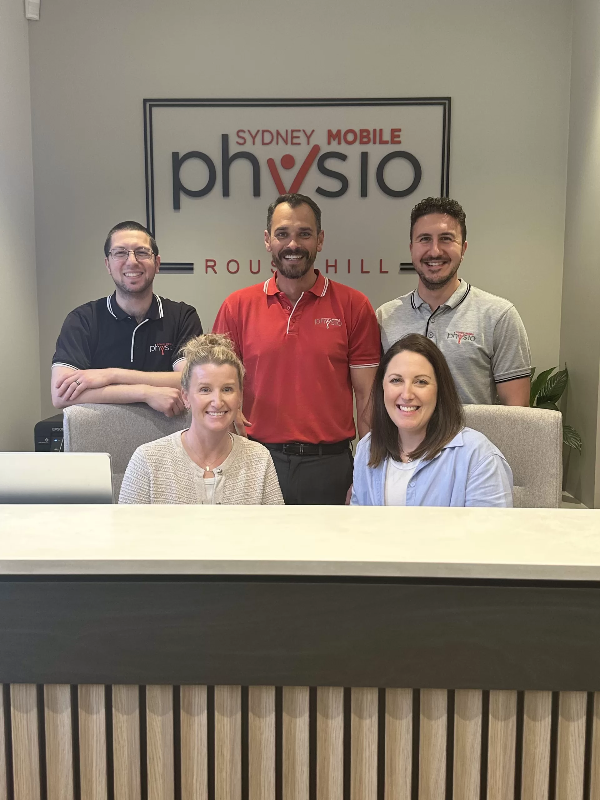 Staff members standing in reception